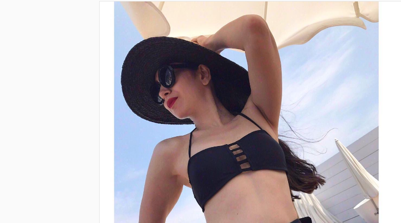 Karisma Kapoor looks absolutely hot in a two piece swimsuit!