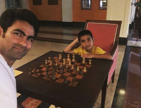Mohammad Kaif playing chess with his son