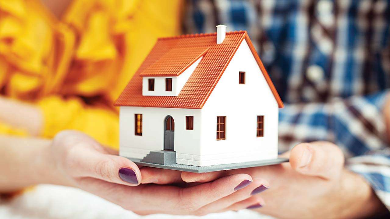 Representative image of a couple buying a house using a home loan