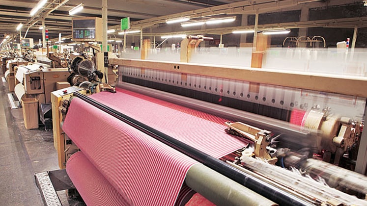 The textile industry is primarily concerned with the design, production and distribution of yarn, cloth and clothing.