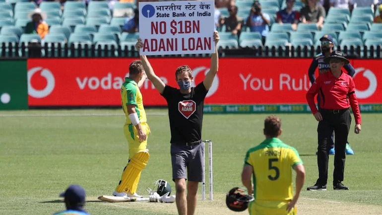 Protestors barge in during India Australia ODI holding ‘No $1B Adani Loan’ signs